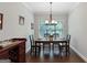 Formal dining room with hardwood floors and modern lighting fixture at 3112 Patriot Sq, Marietta, GA 30064