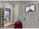 Entryway features a white door, a side door, a red table, and a decorative window at 3112 Patriot Sq, Marietta, GA 30064