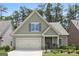 Charming craftsman home with a two-car garage, stone accents, and a well-maintained lawn at 3112 Patriot Sq, Marietta, GA 30064