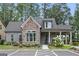 Exterior view of a home with stone facade, covered porch and parking at 3112 Patriot Sq, Marietta, GA 30064