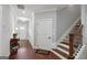 Bright foyer with hardwood floors, staircase, and elegant trim at 3112 Patriot Sq, Marietta, GA 30064