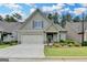 Inviting home with lush landscaping, a two-car garage, and a cozy front entrance at 3112 Patriot Sq, Marietta, GA 30064