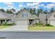 Charming home featuring a well-maintained lawn, a two-car garage, and a welcoming front porch at 3112 Patriot Sq, Marietta, GA 30064
