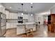 Modern kitchen with white cabinets, stainless steel appliances and a granite countertop island with seating at 3112 Patriot Sq, Marietta, GA 30064