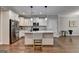 Well-lit kitchen with white cabinets, stainless steel appliances, and granite countertop island with bar stool at 3112 Patriot Sq, Marietta, GA 30064