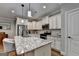 Spacious kitchen featuring white cabinets, granite countertops and stainless steel appliances at 3112 Patriot Sq, Marietta, GA 30064