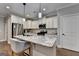 Up-close view of a kitchen island featuring granite countertop and stainless-steel appliances at 3112 Patriot Sq, Marietta, GA 30064