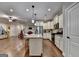 Open concept kitchen with white cabinets, stainless steel appliances and a granite island at 3112 Patriot Sq, Marietta, GA 30064