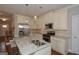 Stylish kitchen with granite counters, stainless appliances, and a spacious island at 3112 Patriot Sq, Marietta, GA 30064
