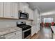 Kitchen featuring stainless steel appliances, granite countertops and adjacent dining area at 3112 Patriot Sq, Marietta, GA 30064
