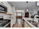 Kitchen featuring granite countertops, stainless steel appliances and adjacent dining area at 3112 Patriot Sq, Marietta, GA 30064