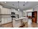 Modern kitchen featuring white cabinets, granite countertops, stainless steel appliances and breakfast bar at 3112 Patriot Sq, Marietta, GA 30064