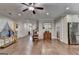 Expansive living room featuring hardwood floors, natural light, and an adjacent view of the kitchen at 3112 Patriot Sq, Marietta, GA 30064