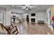Living room featuring hardwood floors, an open layout, fireplace and view into the kitchen at 3112 Patriot Sq, Marietta, GA 30064