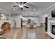 Open-concept living room and kitchen featuring hardwood floors, granite countertops, and stainless steel appliances at 3112 Patriot Sq, Marietta, GA 30064