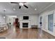 Living room featuring hardwood floors, a fireplace, and an open layout with modern finishes at 3112 Patriot Sq, Marietta, GA 30064