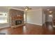 Spacious living room with a stone fireplace, hardwood floors, and abundant natural light at 3112 Patriot Sq, Marietta, GA 30064