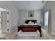 Bright main bedroom with neutral color scheme, plush carpet, and ensuite bathroom entrance at 3112 Patriot Sq, Marietta, GA 30064