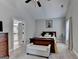 Bright main bedroom with neutral color scheme, plush carpet, and ensuite bathroom entrance at 3112 Patriot Sq, Marietta, GA 30064