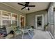 Cozy screened porch with ceiling fan, table, chairs, offering a relaxing outdoor space at 3112 Patriot Sq, Marietta, GA 30064