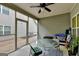 Covered screened porch featuring a ceiling fan, a glass topped table and outdoor seating at 3112 Patriot Sq, Marietta, GA 30064