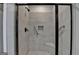 Tiled walk-in shower with a bench and grab bar at 3112 Patriot Sq, Marietta, GA 30064