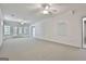 Finished basement features recessed lighting, neutral carpet, and access to the exterior at 133 Sea Island Dr, Peachtree City, GA 30269