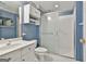 Bathroom featuring a clean white vanity and an enclosed shower with sliding glass doors at 133 Sea Island Dr, Peachtree City, GA 30269