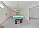 Basement billiards room ready for play, with recessed lighting and neutral carpet at 133 Sea Island Dr, Peachtree City, GA 30269