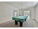 Billiards room with neutral carpet and bright lighting, perfect for entertaining guests at 133 Sea Island Dr, Peachtree City, GA 30269
