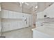 Spacious kitchen featuring white cabinetry, countertops, and modern appliances at 133 Sea Island Dr, Peachtree City, GA 30269