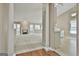 Open-concept living room with a fireplace, hardwood floors, and views into the kitchen and dining area at 133 Sea Island Dr, Peachtree City, GA 30269