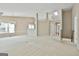 Expansive living room with neutral carpet, a fireplace, and ample natural light at 133 Sea Island Dr, Peachtree City, GA 30269