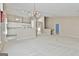 Expansive living space with a chandelier, fireplace, and open design for seamless flow and entertaining possibilities at 133 Sea Island Dr, Peachtree City, GA 30269