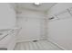 Organized walk-in closet with shelving and carpet at 133 Sea Island Dr, Peachtree City, GA 30269