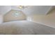 Large bonus room featuring carpet floors, a single window, and neutral colors at 150 Surrey Chase Dr, Social Circle, GA 30025