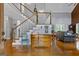 Foyer features hardwood floors, staircase, decor, and open access to other rooms at 150 Surrey Chase Dr, Social Circle, GA 30025