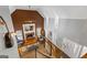 Spacious living room with fireplace, hardwood floors, large windows, and ample natural light at 150 Surrey Chase Dr, Social Circle, GA 30025