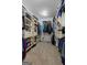 Organized walk-in closet with custom shelving, ample storage space, and bright lighting at 150 Surrey Chase Dr, Social Circle, GA 30025
