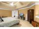 Bedroom with a ceiling fan, and a view into the hall, complemented by neutral-colored walls and carpeting at 1014 Overlook Dr, Villa Rica, GA 30180