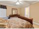Well-lit bedroom showcasing neutral-toned walls, carpeting, and a glimpse into an adjacent bathroom at 1014 Overlook Dr, Villa Rica, GA 30180
