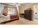 Comfortable bedroom featuring a canopy bed, desk, dresser, and shuttered windows that provide natural light at 1014 Overlook Dr, Villa Rica, GA 30180