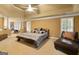 Spacious bedroom with a sitting area, complemented by neutral-colored walls and plush carpeting at 1014 Overlook Dr, Villa Rica, GA 30180