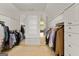 A large walk-in closet with custom built-in cabinets and drawers for ample storage space at 1014 Overlook Dr, Villa Rica, GA 30180