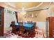 Elegant dining room featuring a large table, chandelier, and wainscoting, perfect for hosting gatherings at 1014 Overlook Dr, Villa Rica, GA 30180