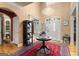 Grand foyer with soaring ceilings, elegant chandelier, and a striking red and navy rug, creating a welcoming entrance at 1014 Overlook Dr, Villa Rica, GA 30180