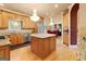 Spacious kitchen features wood cabinetry, granite countertops, stainless steel appliances, and a central island at 1014 Overlook Dr, Villa Rica, GA 30180