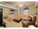 Comfortable living room features a large, sectional leather sofa, offering an inviting space for relaxation at 1014 Overlook Dr, Villa Rica, GA 30180