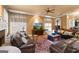 Inviting living room with comfortable sofas, a ceiling fan, and a mounted television, perfect for relaxation at 1014 Overlook Dr, Villa Rica, GA 30180