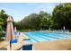 Sparkling community pool surrounded by lush greenery, offering a refreshing escape at 1014 Overlook Dr, Villa Rica, GA 30180